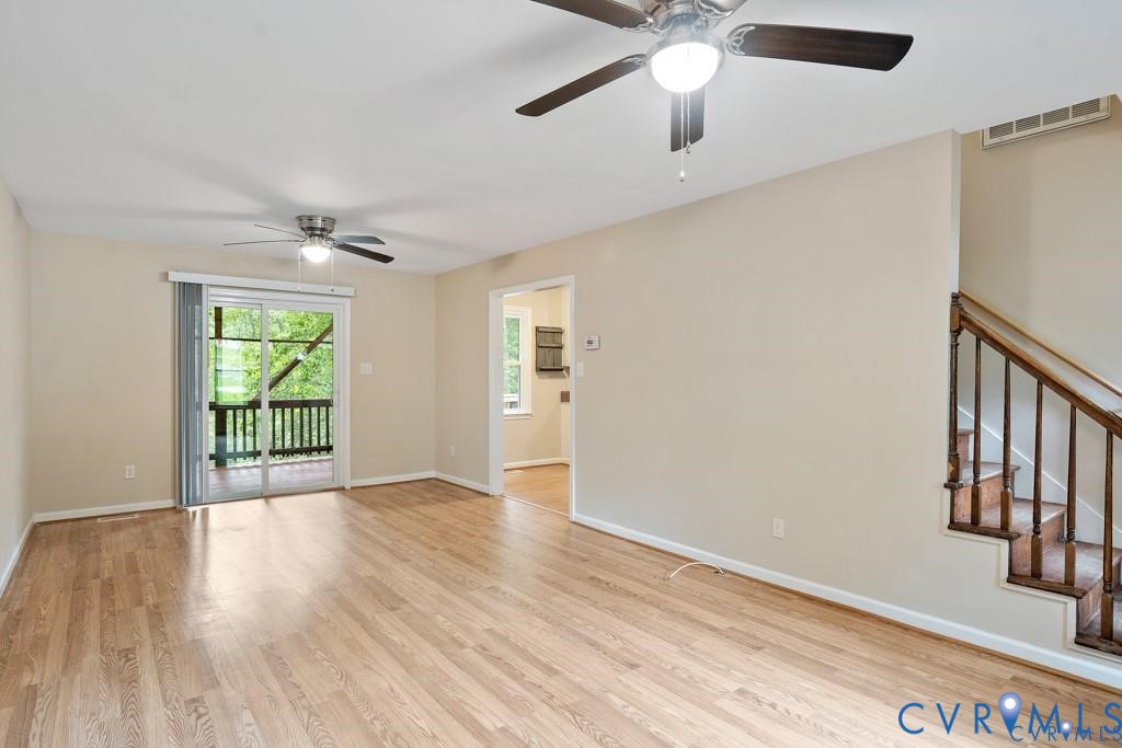 4001 London Road Hopewell, VA 23860 - Photo 3 of 8 a view of an empty room with a window and wooden floor