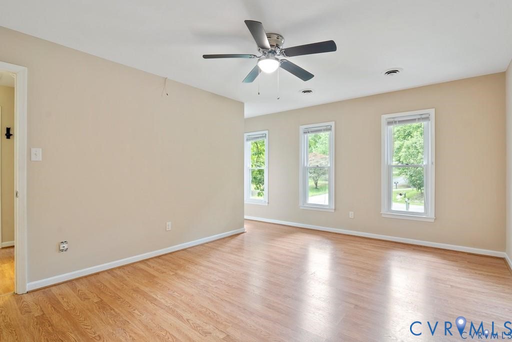 4001 London Road Hopewell, VA 23860 - Photo 7 of 8 a view of an empty room with wooden floor and a window