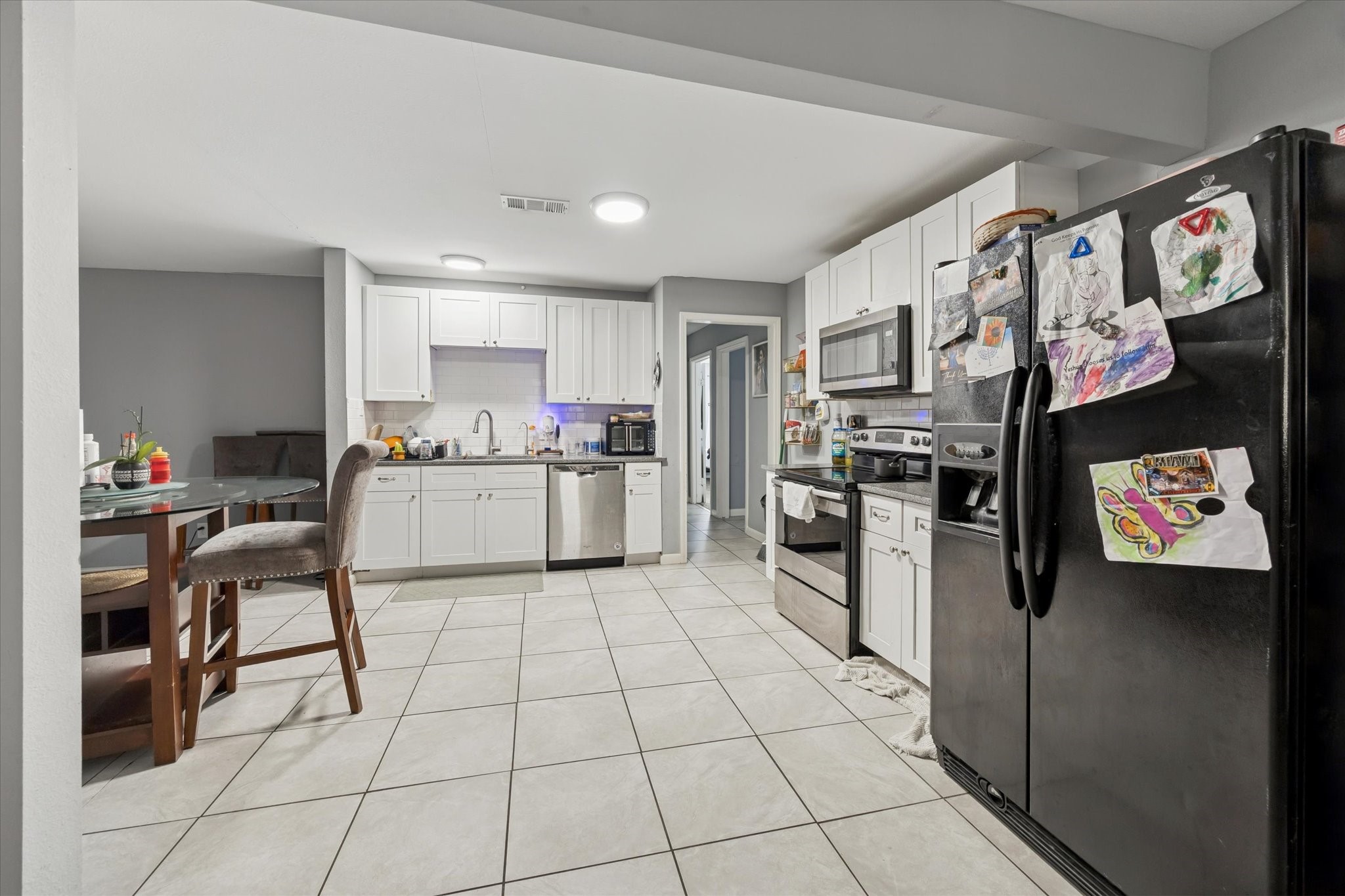 1435 Demaree Lane Houston, TX 77029 - Photo 4 of 10 a kitchen with stainless steel appliances granite countertop a refrigerator and a stove top oven
