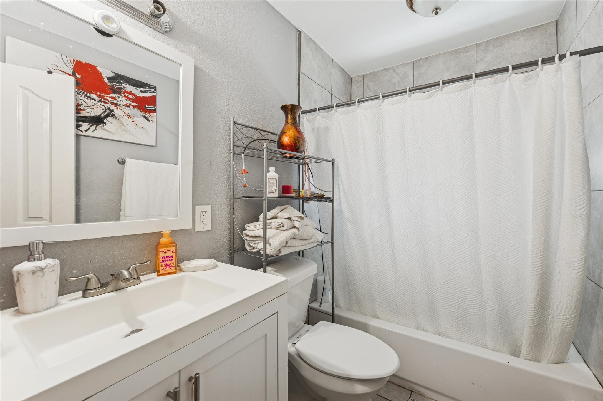 1435 Demaree Lane Houston, TX 77029 - Photo 9 of 10 a bathroom with a sink toilet and shower