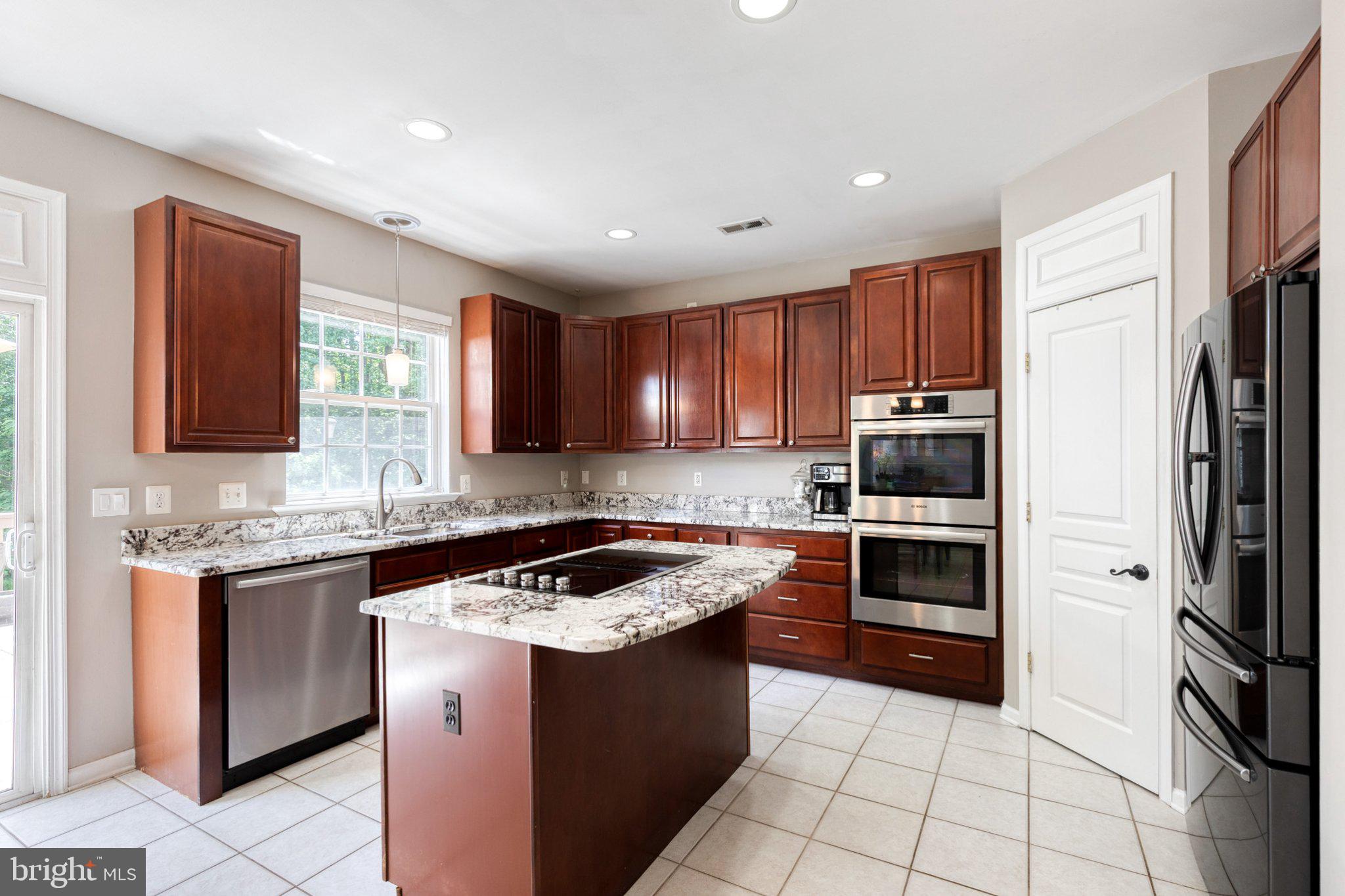 9741 Starling Road Ellicott City, MD 21042 - Photo 13 of 64 Modern kitchen with rich cabinetry.