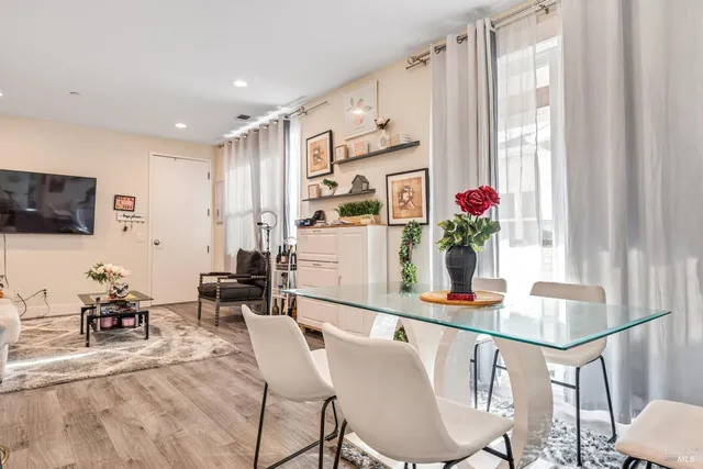 a dining room with furniture and window