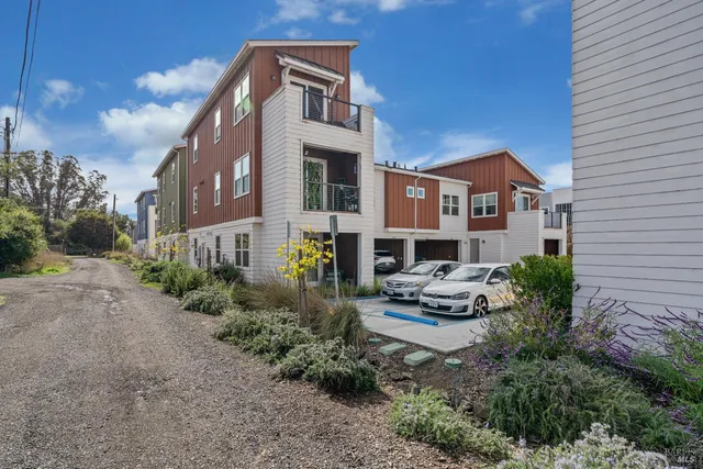 a front view of a house with sitting area