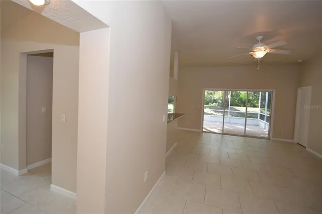 a view of kitchen with kitchen island stainless steel appliances refrigerator stove microwave and cabinets