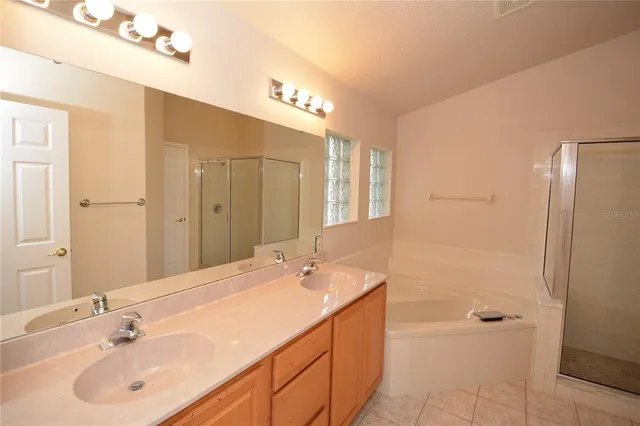 a bathroom with a shower and a sink