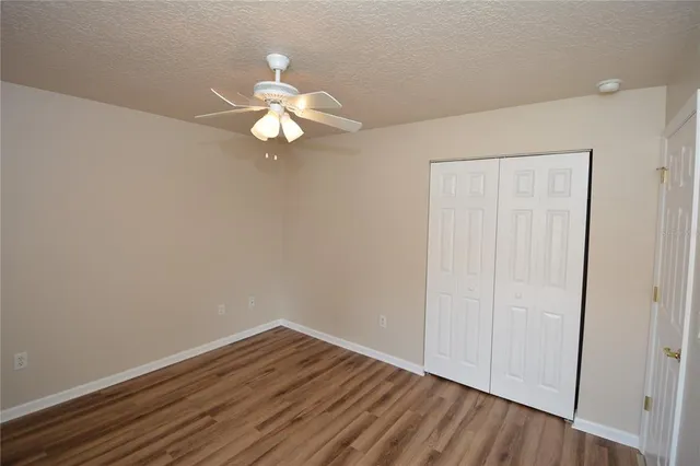 a view of a park with swings and slides