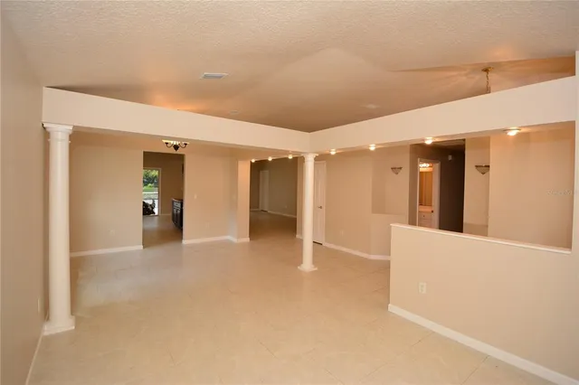 a view of an empty room and window