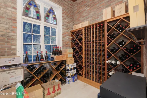a view of a room with wooden floor and chair