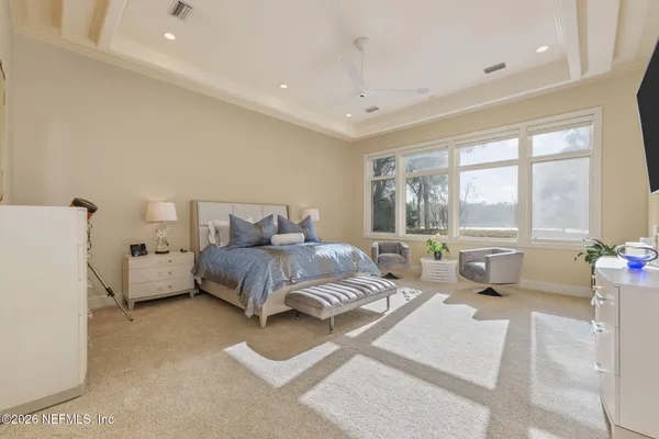 a bedroom with a bed and a table