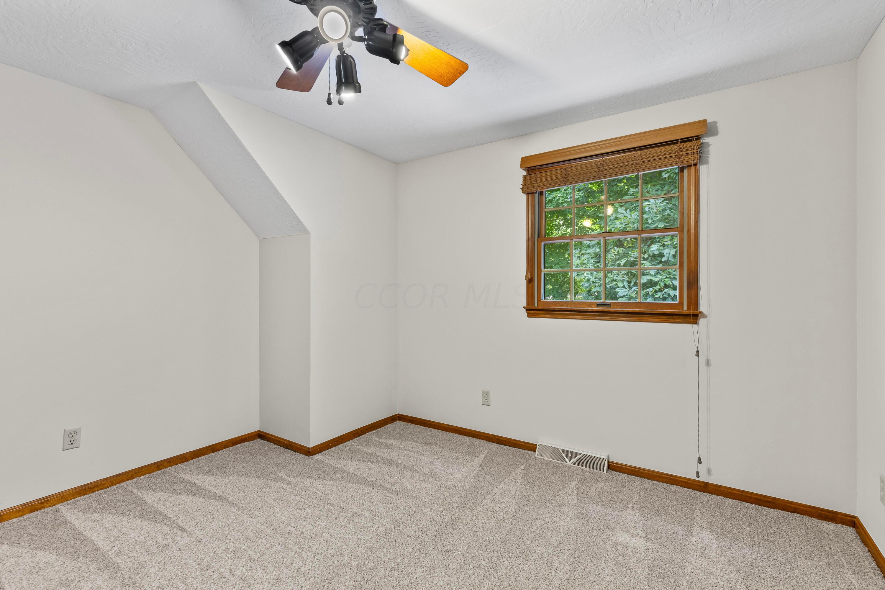 6940 Graham Road Mount Vernon, OH 43050 - Photo 44 of 70 • New light sand carpet
~ 06/2024
• Ivory painted walls
• Lighted ceiling fan
• Single door closet with
attic access
• 2” wood blinds