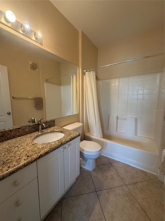 2715 Via Capri, Unit 732 Clearwater, FL 33764 - Photo 17 of 31 a bathroom with a granite countertop sink and a mirror