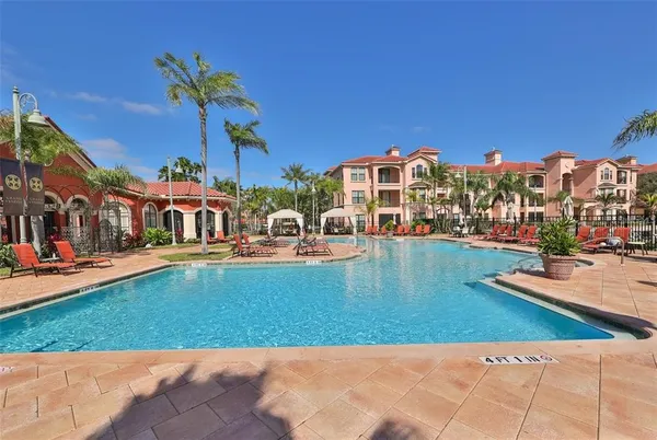 a view of swimming pool with outdoor seating