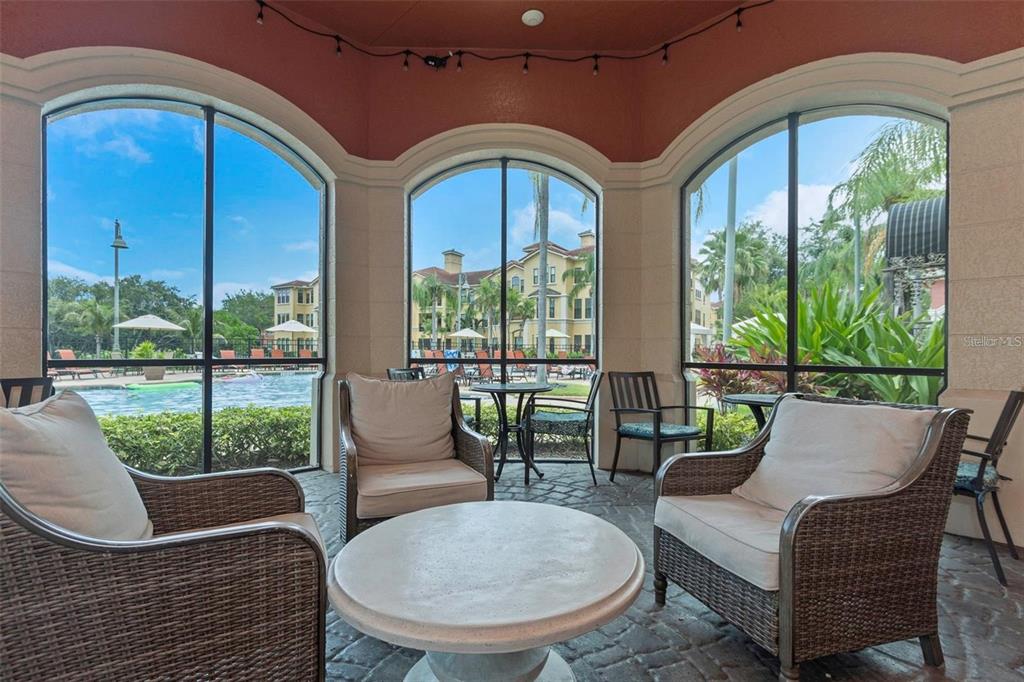 2715 Via Capri, Unit 732 Clearwater, FL 33764 - Photo 26 of 31 a living room with large windows