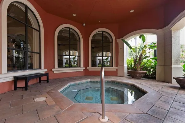 a swimming pool with outdoor seating yard and outdoor seating