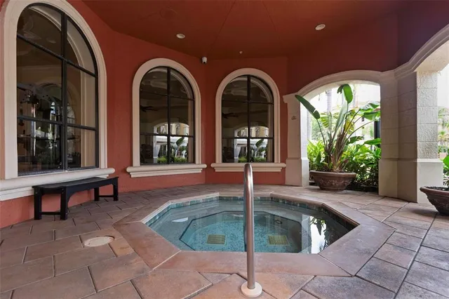 a swimming pool with outdoor seating yard and outdoor seating