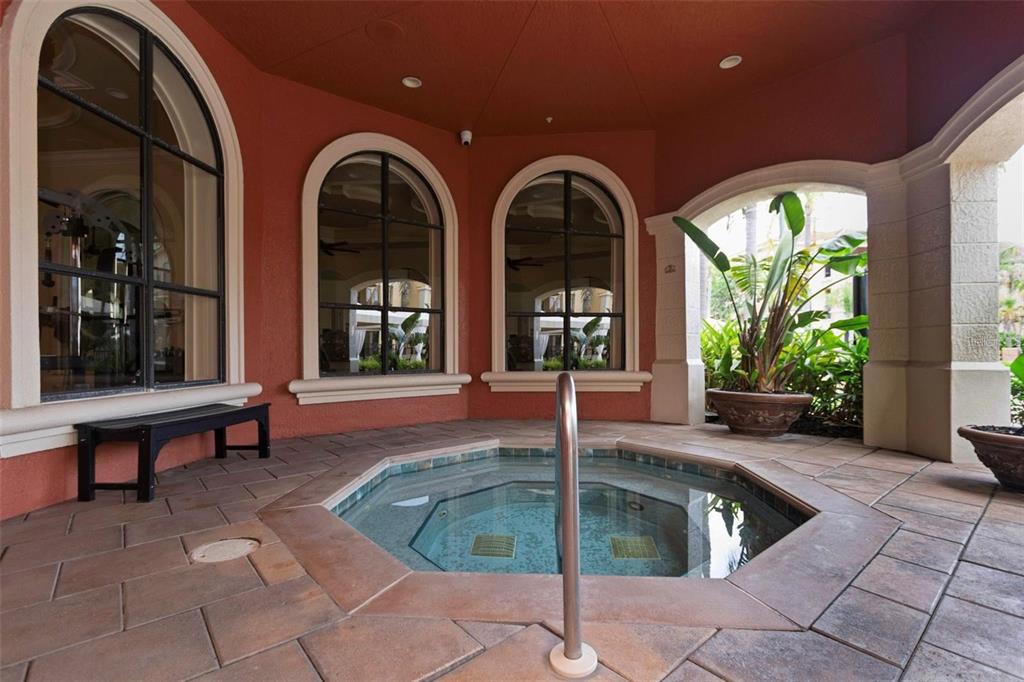 2715 Via Capri, Unit 732 Clearwater, FL 33764 - Photo 27 of 31 a swimming pool with outdoor seating yard and outdoor seating