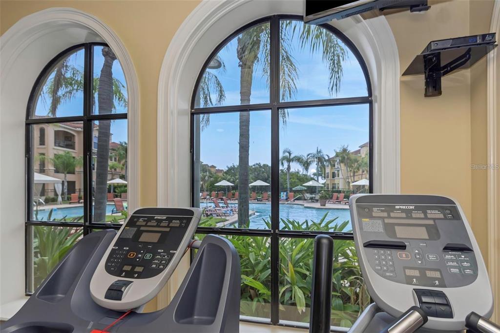 2715 Via Capri, Unit 732 Clearwater, FL 33764 - Photo 28 of 31 a view of a balcony with furniture and floor to ceiling window