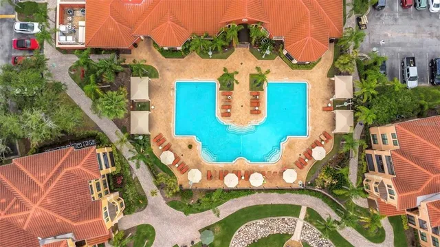 an aerial view of a house having swimming pool