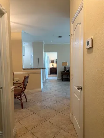 a view of a livingroom with furniture and a bathroom