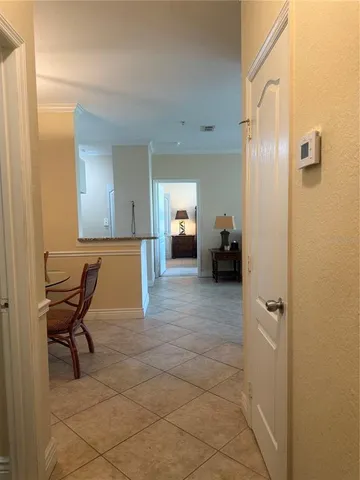 a view of a livingroom with furniture and a bathroom