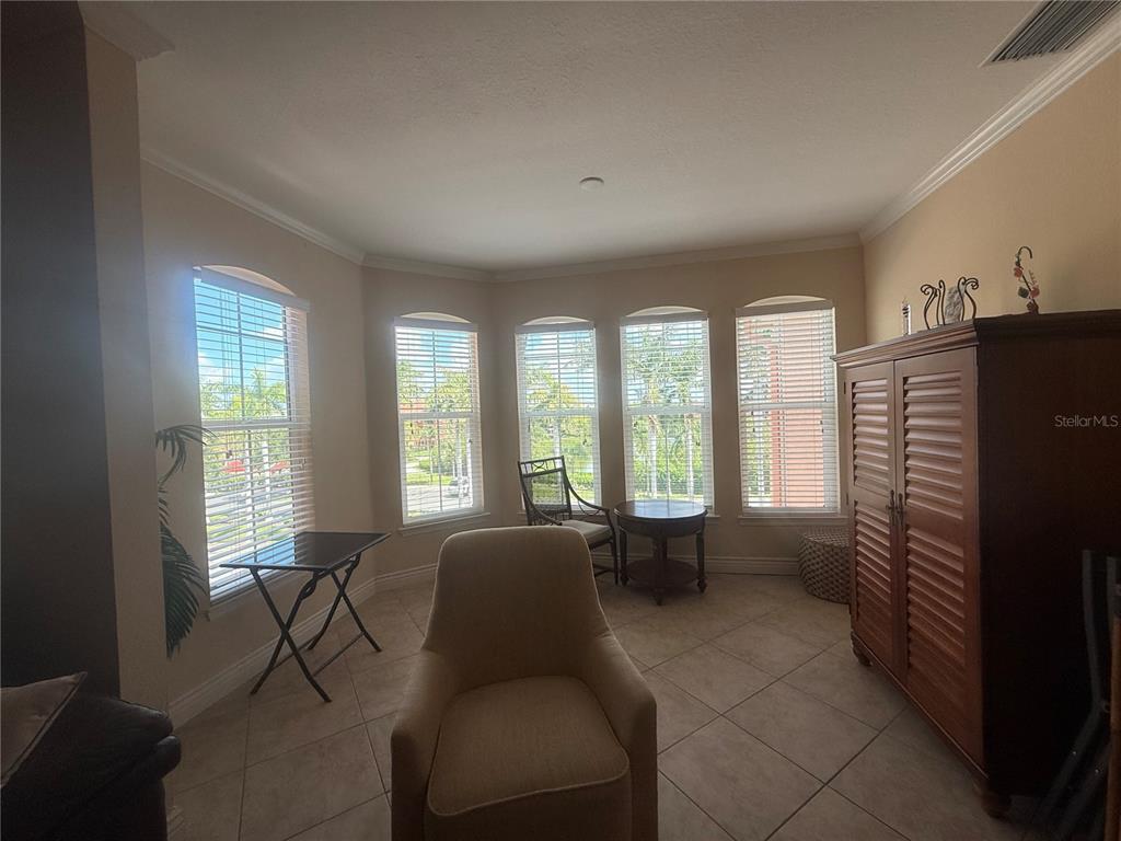 2715 Via Capri, Unit 732 Clearwater, FL 33764 - Photo 10 of 31 a living room with furniture and a flat screen tv