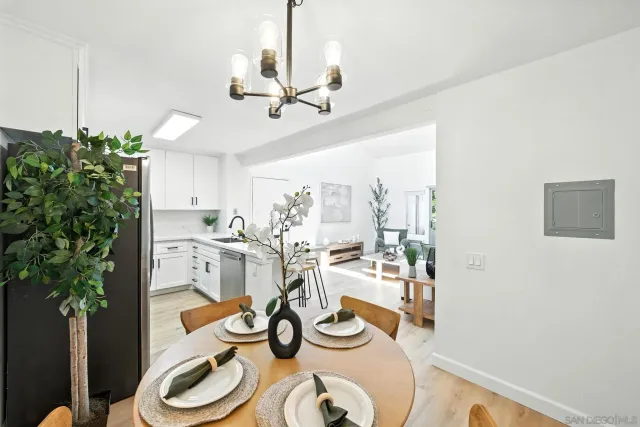 a very nice looking dining room with a table and chairs