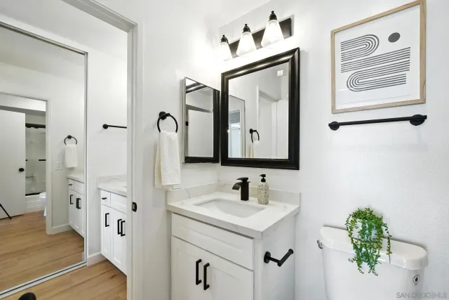 a bathroom with mirror a sink and a mirror