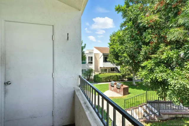 a view of a balcony with furniture
