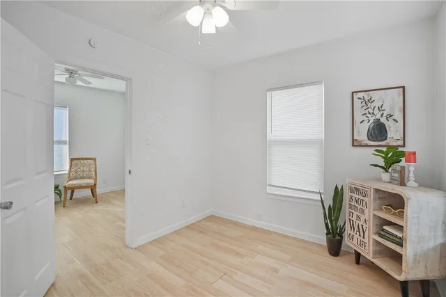 a view of kitchen with furniture and a potted plant