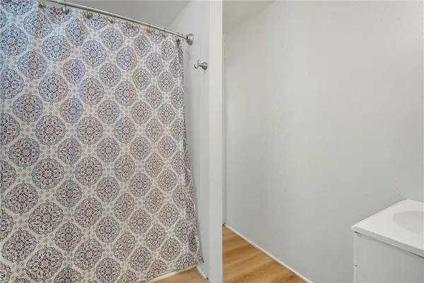 a bathroom with a shower curtain