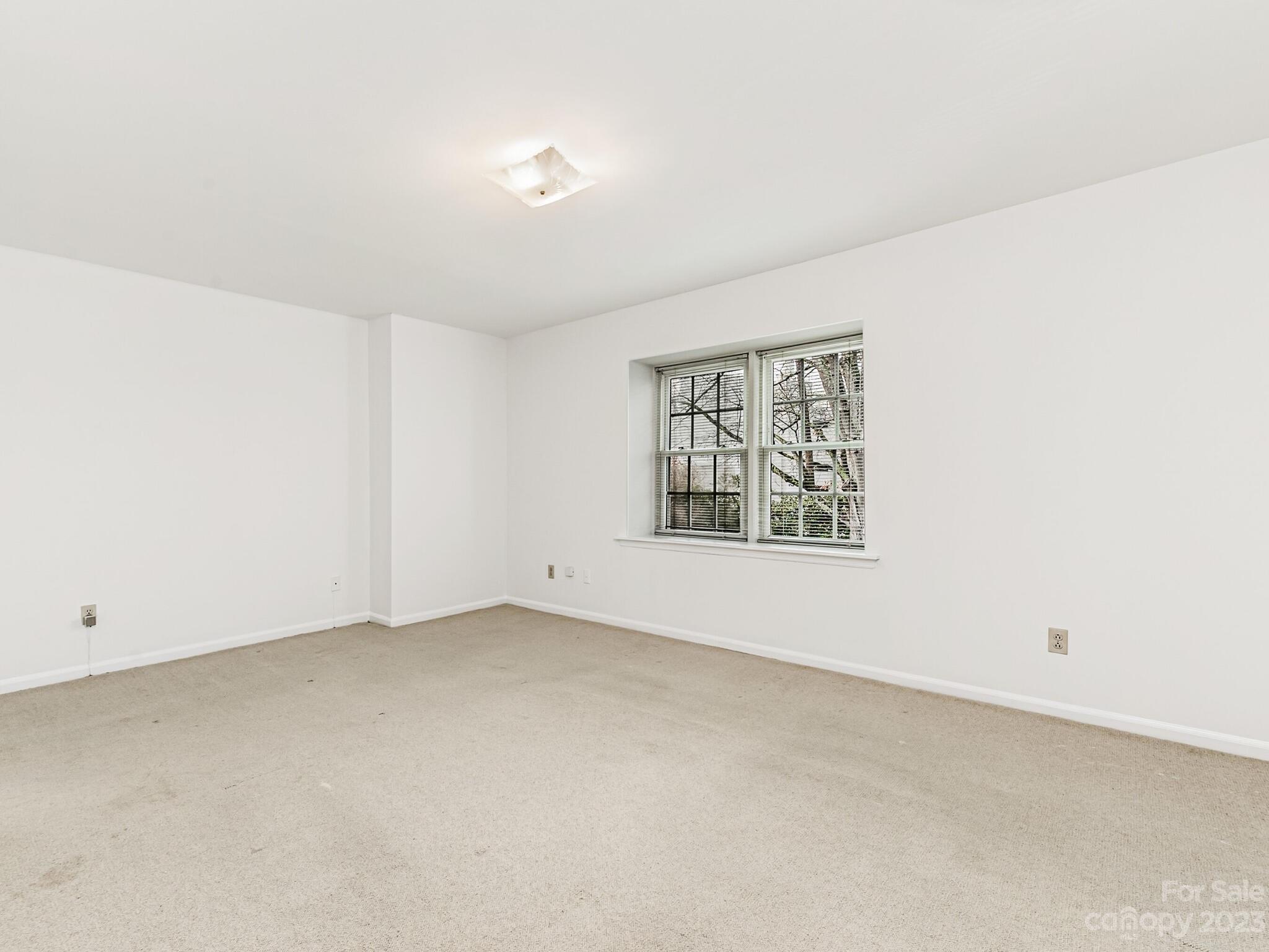 2227 Rexford Road, Unit B Charlotte, NC 28211 - Photo 12 of 23 an empty room with windows