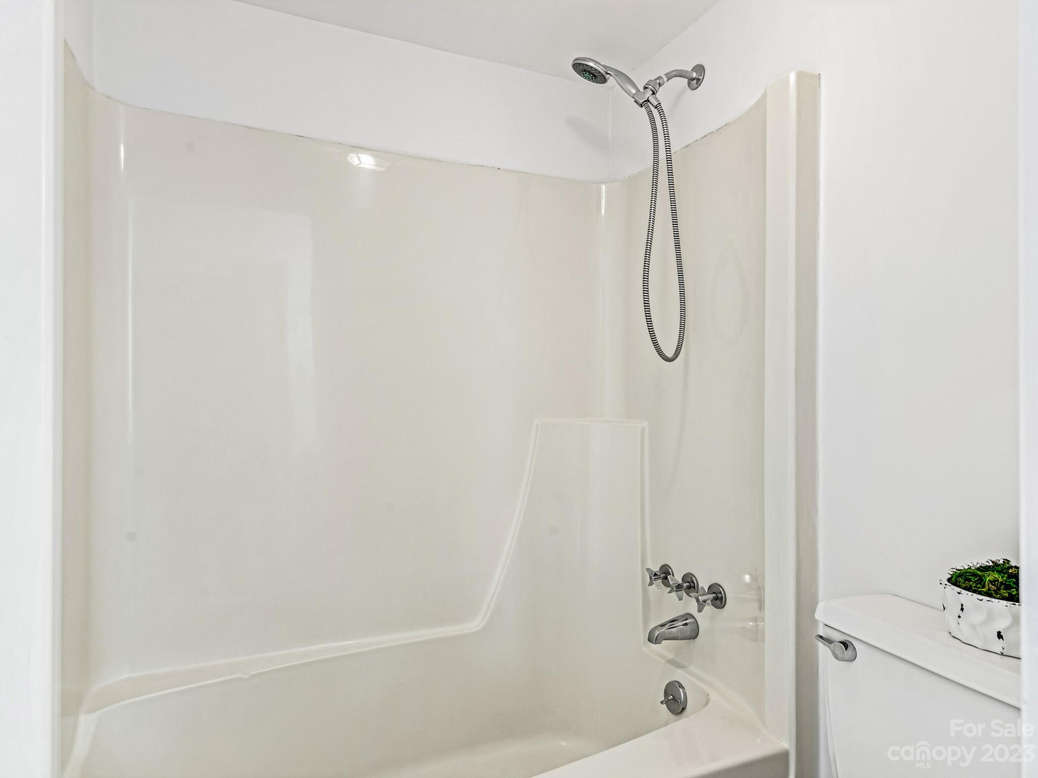 2227 Rexford Road, Unit B Charlotte, NC 28211 - Photo 14 of 23 a bathroom with a bath tub with shower