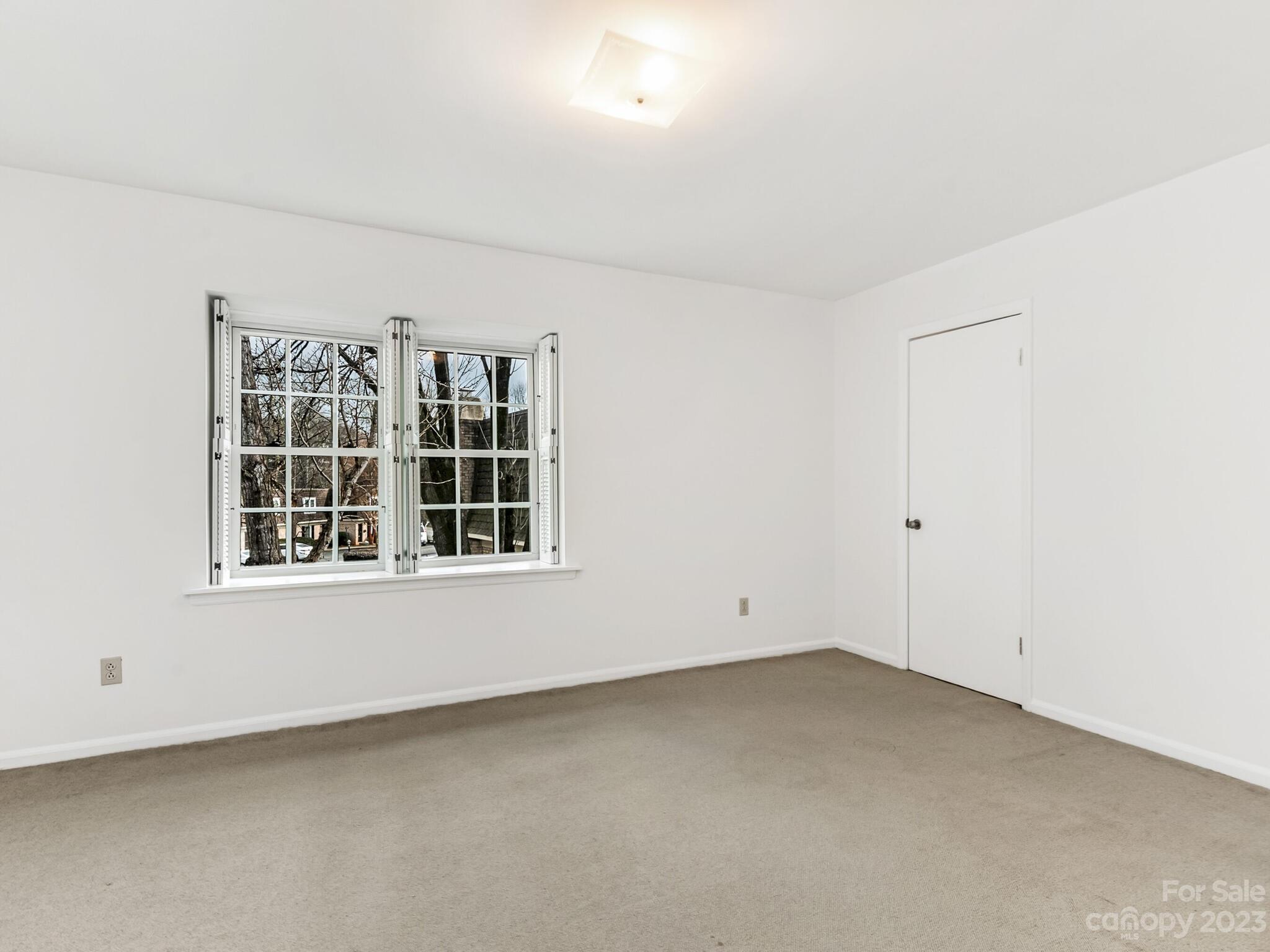 2227 Rexford Road, Unit B Charlotte, NC 28211 - Photo 15 of 23 an empty room with a window