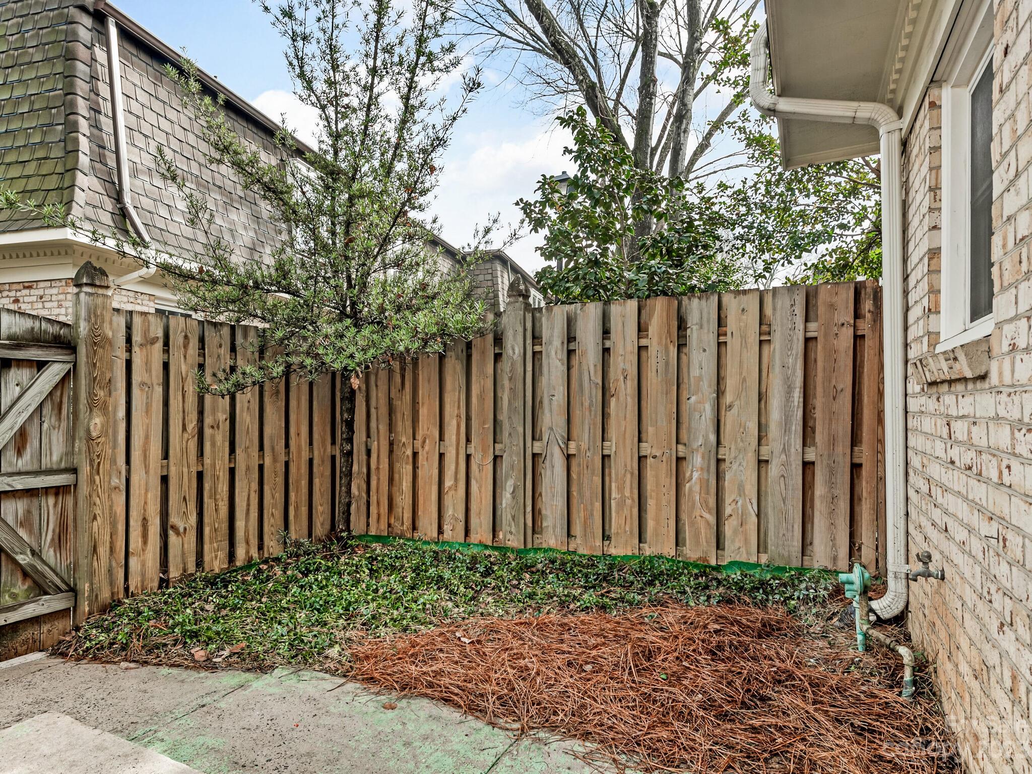 2227 Rexford Road, Unit B Charlotte, NC 28211 - Photo 18 of 23 a wooden fence with trees in front of it