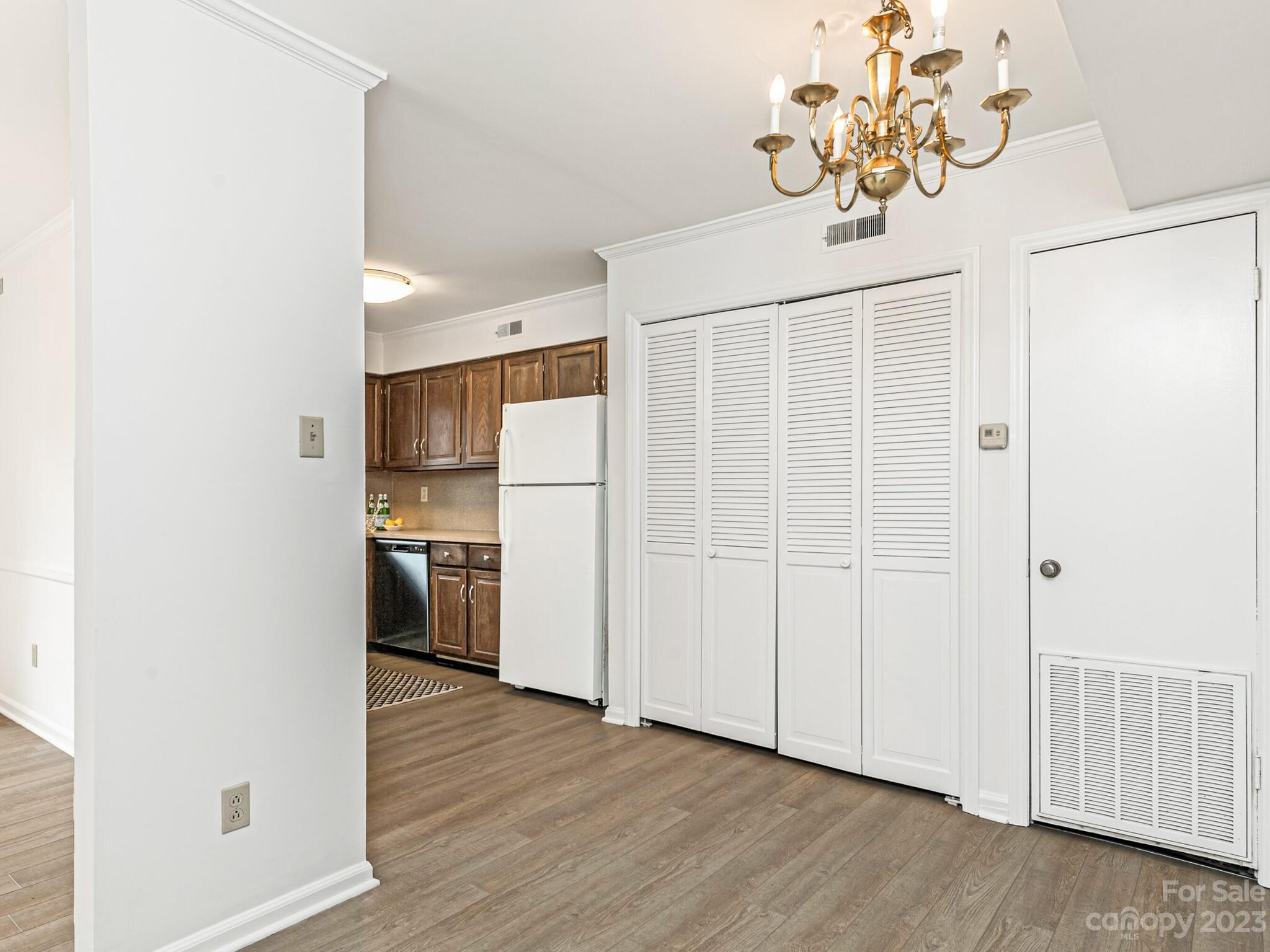 2227 Rexford Road, Unit B Charlotte, NC 28211 - Photo 9 of 23 a view of a kitchen with a sink refrigerator and wooden floor
