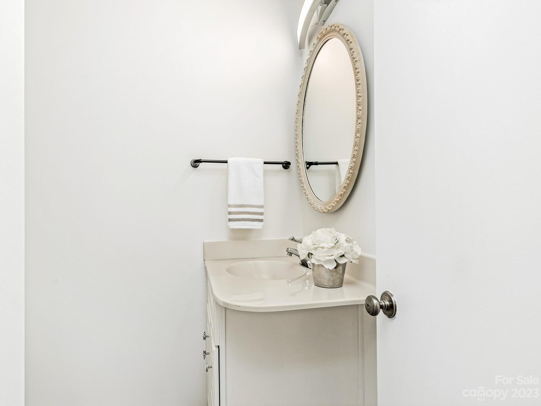 2227 Rexford Road, Unit B Charlotte, NC 28211 - Photo 10 of 23 a bathroom with a sink and a mirror