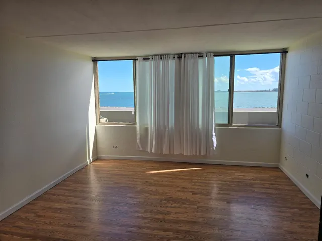 a view of wooden floor and brick walls