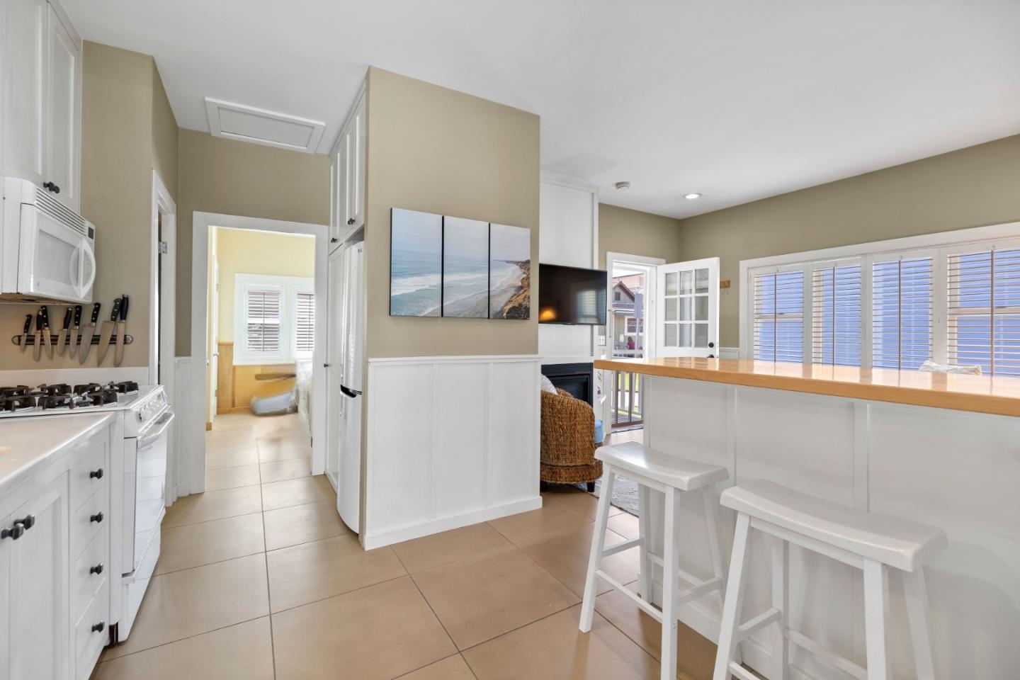 106 Lawn Way Capitola, CA 95010 - Photo 11 of 21 a kitchen with a stove a refrigerator and a sink