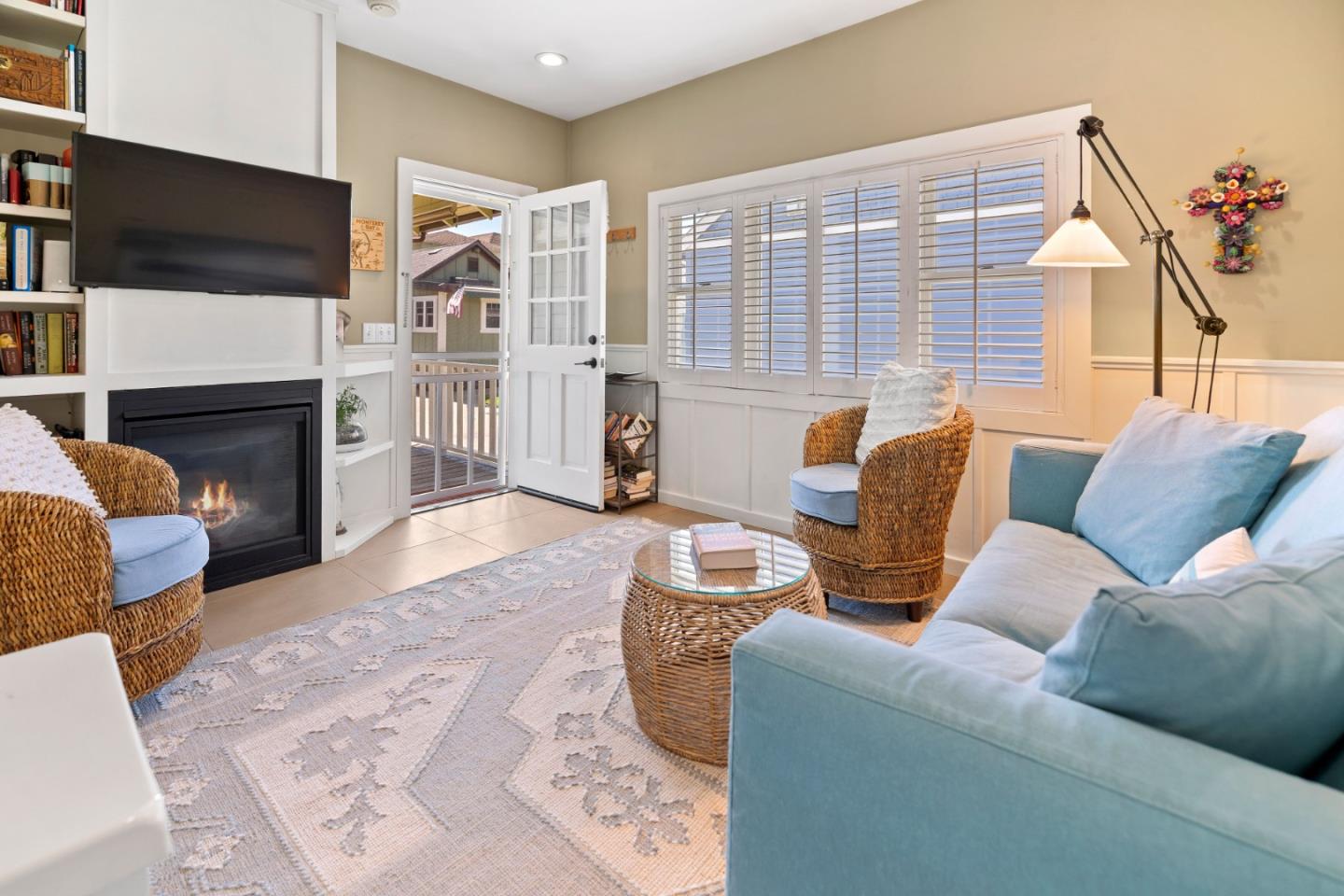 106 Lawn Way Capitola, CA 95010 - Photo 5 of 21 a living room with furniture a flat screen tv and a fireplace