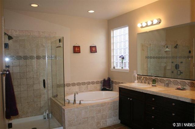 9280 Lost Valley Road Reno, NV 89521 - Photo 7 of 13 a bathroom with a bathtub shower sink and mirror