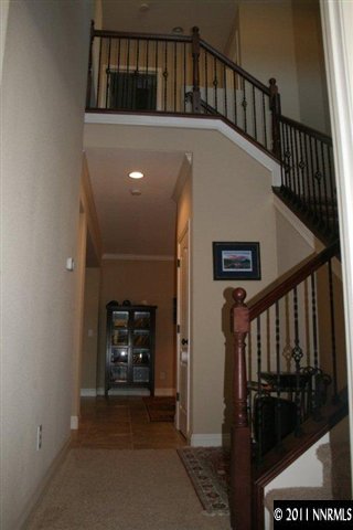 9280 Lost Valley Road Reno, NV 89521 - Photo 9 of 13 a view of hall way with wooden floor and a fireplace