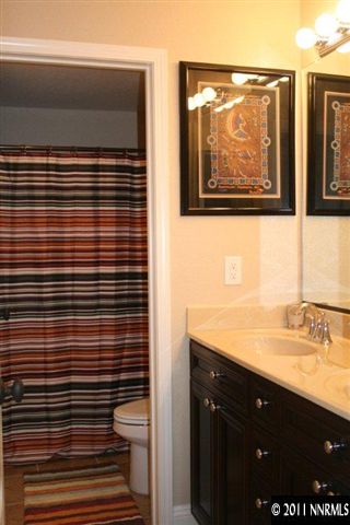 9280 Lost Valley Road Reno, NV 89521 - Photo 10 of 13 a bathroom with a sink a toilet and mirror