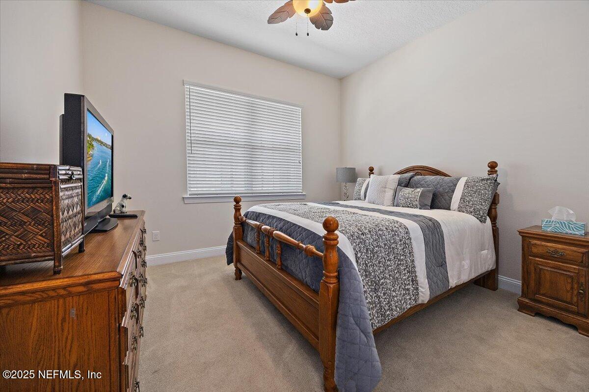 166 Portside Avenue Ponte Vedra, FL 32081 - Photo 15 of 46 a bedroom with a bed and a flat screen tv