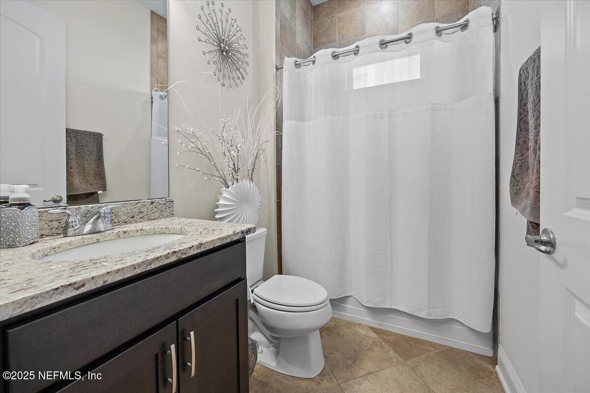 166 Portside Avenue Ponte Vedra, FL 32081 - Photo 16 of 46 a bathroom with a granite countertop sink toilet and shower