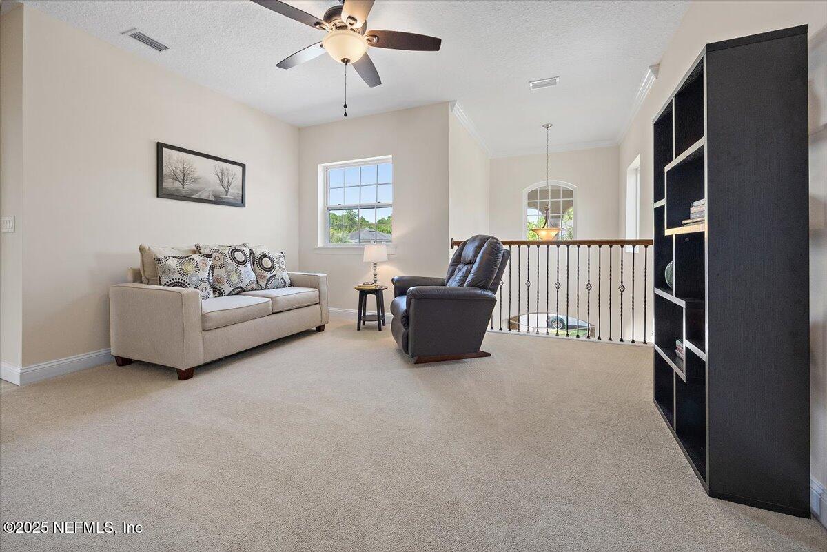 166 Portside Avenue Ponte Vedra, FL 32081 - Photo 17 of 46 a living room with furniture fireplace and a window