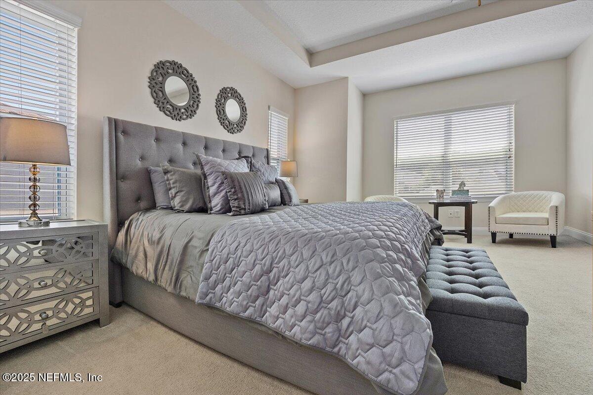 166 Portside Avenue Ponte Vedra, FL 32081 - Photo 21 of 46 a bedroom with a bed and window