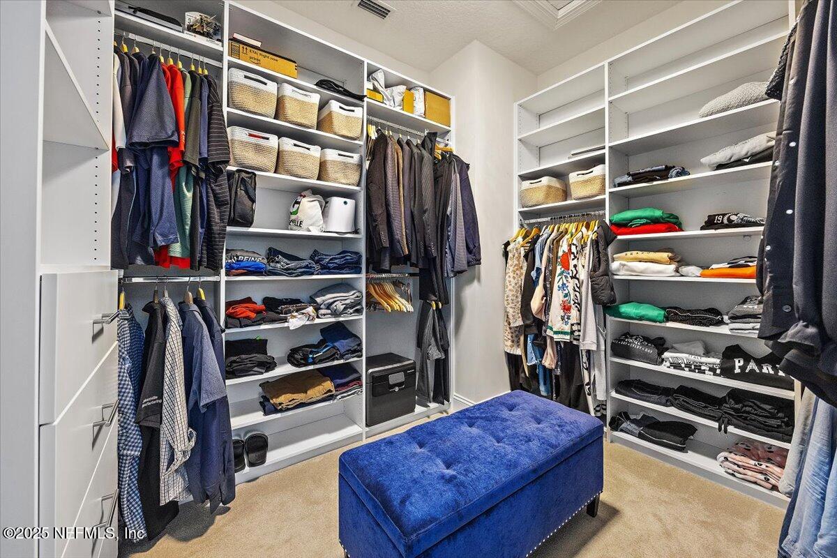 166 Portside Avenue Ponte Vedra, FL 32081 - Photo 24 of 46 a view of walk in closet with clothes and shoes