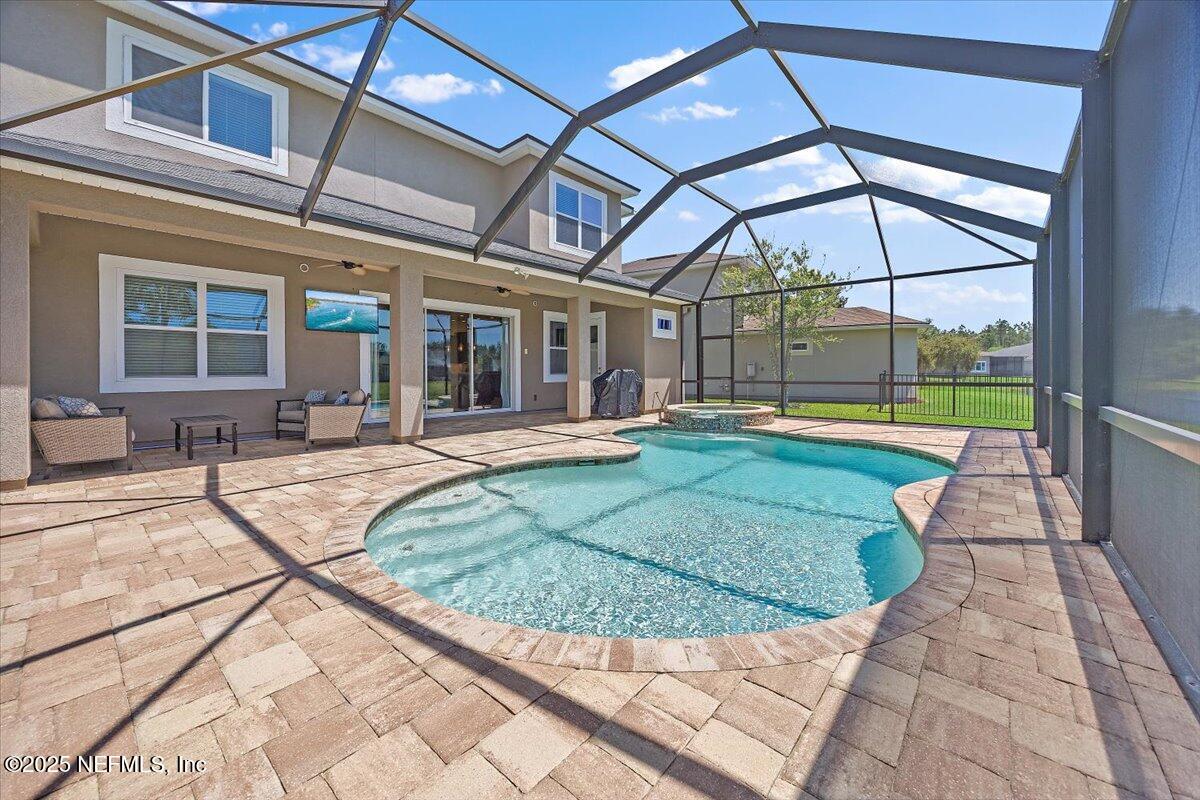 166 Portside Avenue Ponte Vedra, FL 32081 - Photo 30 of 46 a view of a house with a backyard