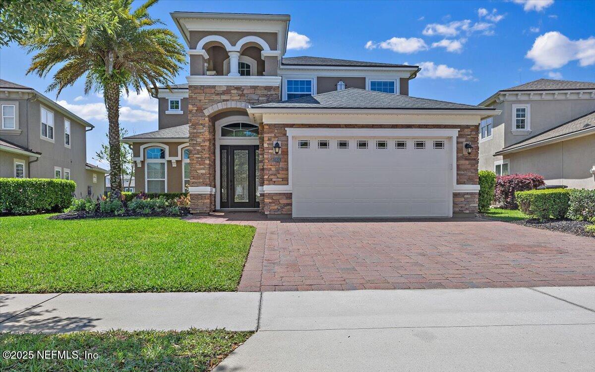 166 Portside Avenue Ponte Vedra, FL 32081 - Photo 46 of 46 a front view of a house with garden