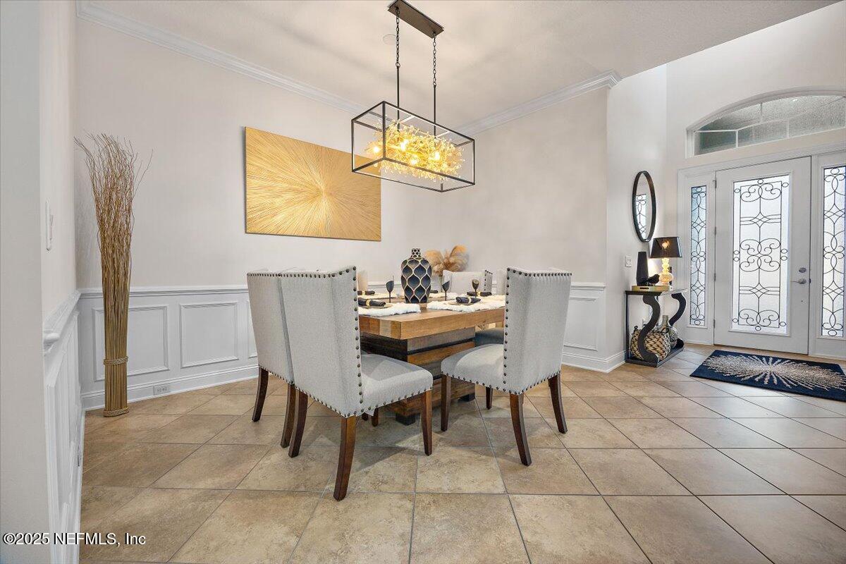 166 Portside Avenue Ponte Vedra, FL 32081 - Photo 6 of 46 a dining room with furniture and chandelier